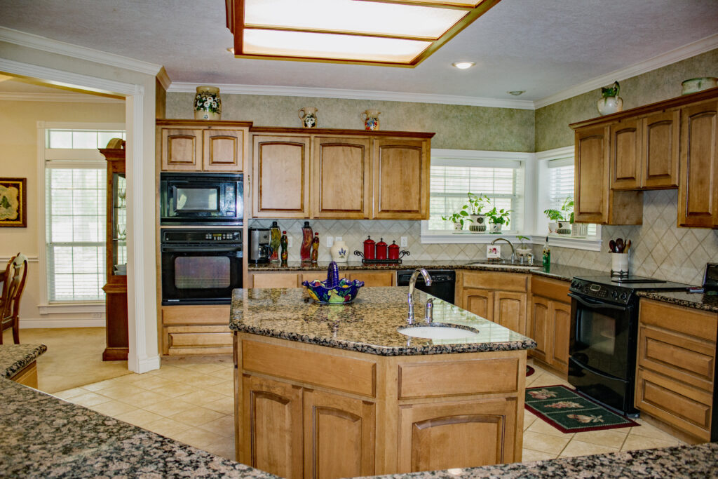 Kitchen with granite counter and wood cabinets